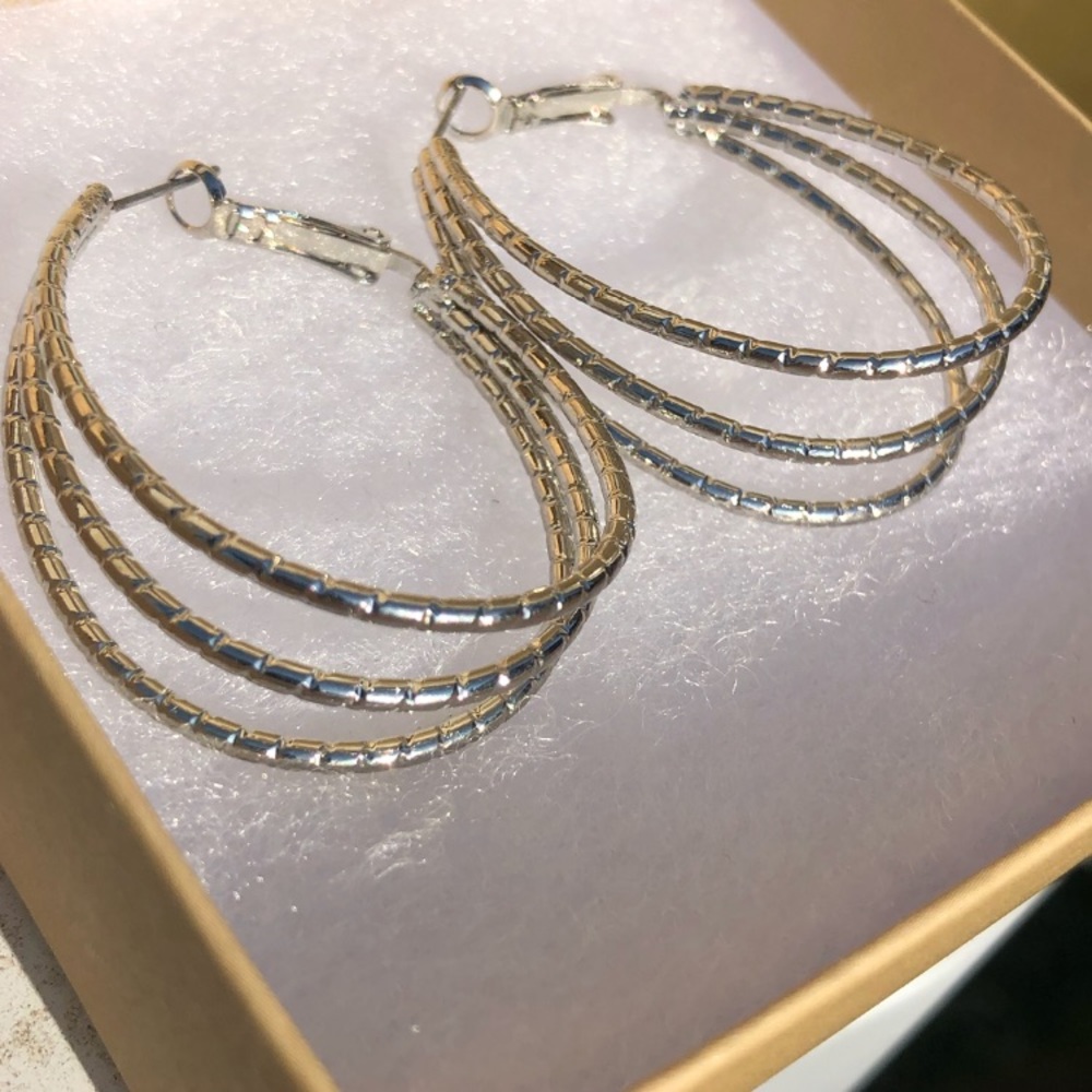 Karma and Luck Sterling Silver Hoop Earrings.